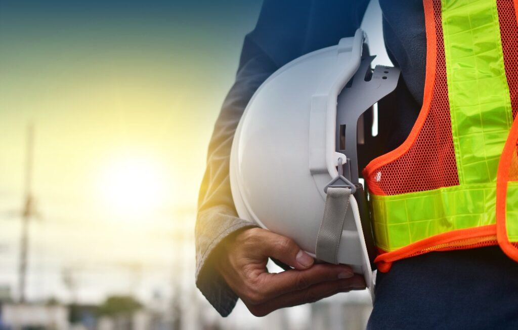 Worker holding hardhat