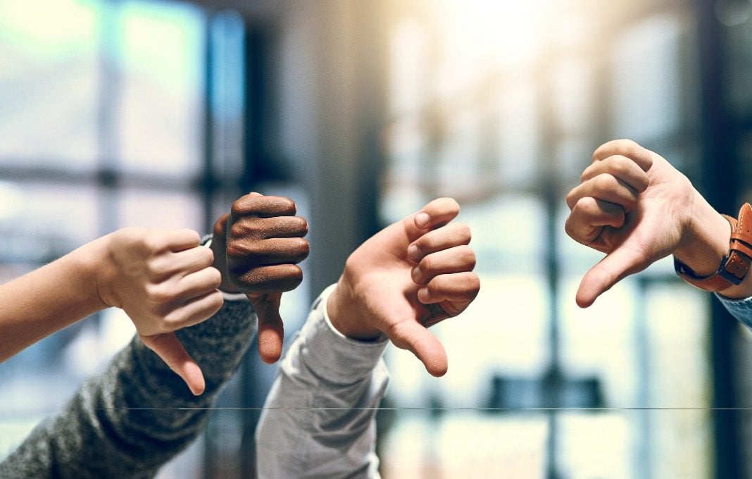Business people, thumbs down