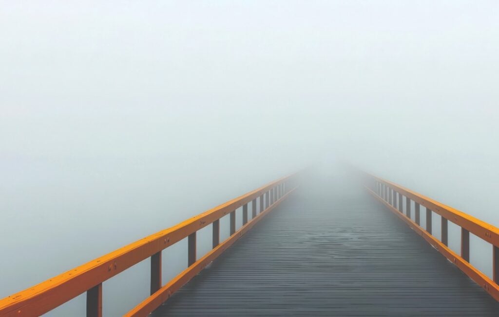 Bridge disappearing into fog