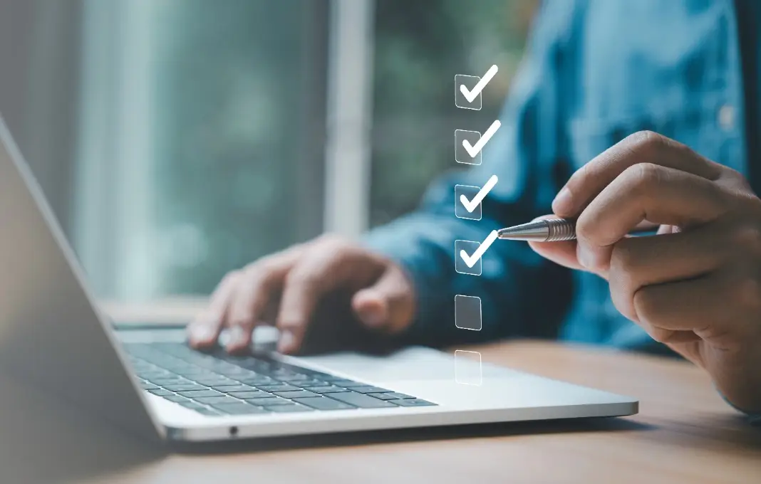 Businessman use pen to tick correct sign mark in checkbox