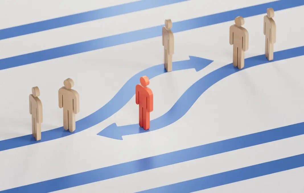 Red and white Wooden dolls with blue arrows.