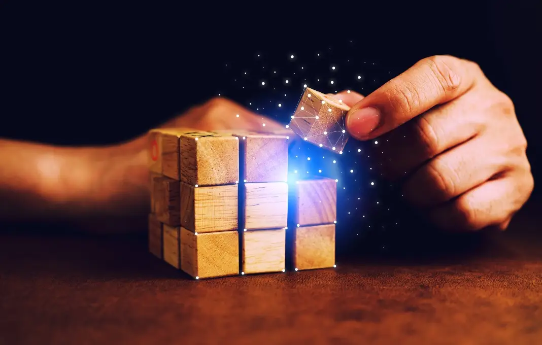 Hands stacking wooden blocks with blue light overlaid