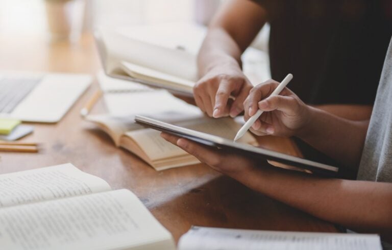 Close-up view of university students discussing their group project