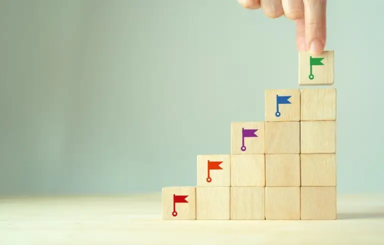 Wooden blocks with colored flags stacked on top of one another