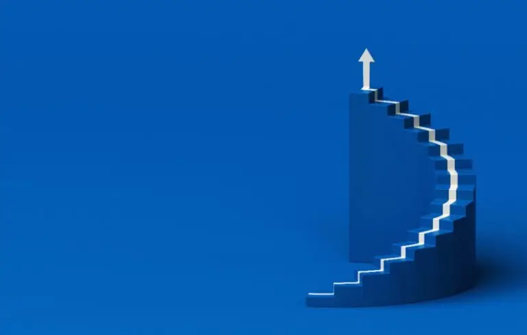 White arrow following the spiral staircase of growth on blue background