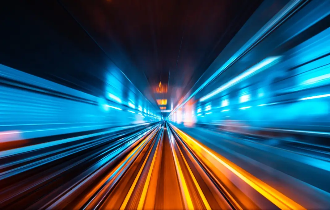 Train moving fast through tunnel