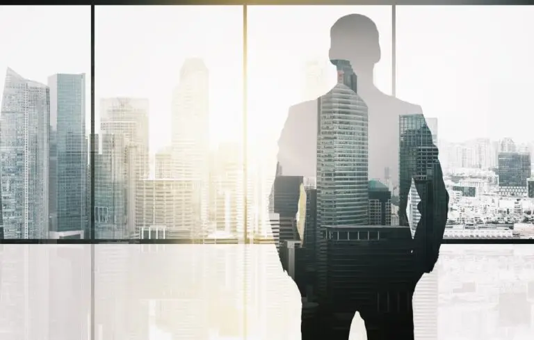 silhouette of business man over office background