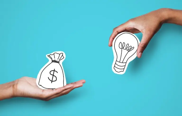 Hands with dollar sign bag and white light bulb