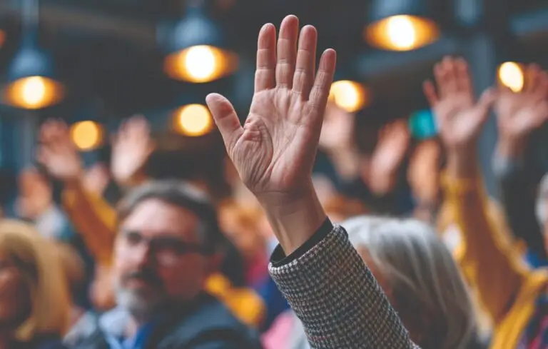 Raised hand in an audience