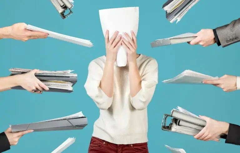 an office worker hid behind a document, Office worker overworked