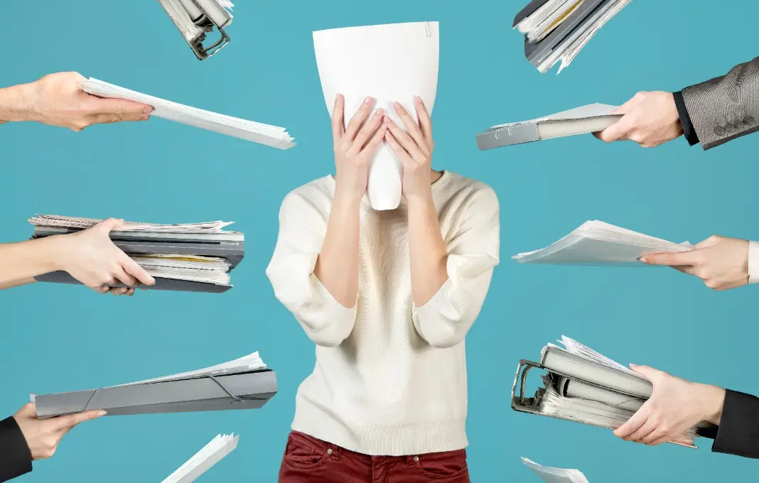 an office worker hid behind a document, Office worker overworked