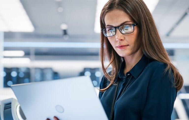 Woman looking at laptop